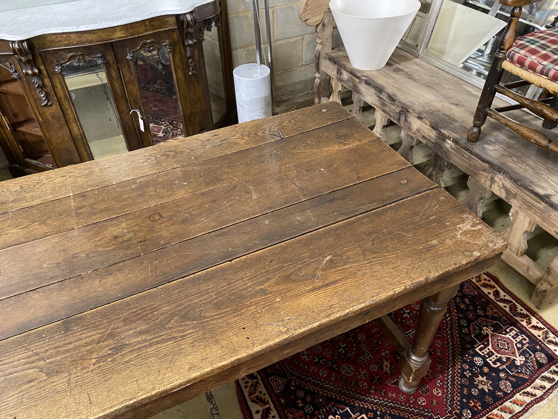 A rectangular oak refectory dining table, length 183cm, depth 87cm, height 76cm